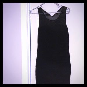 Above knee, slim black dress